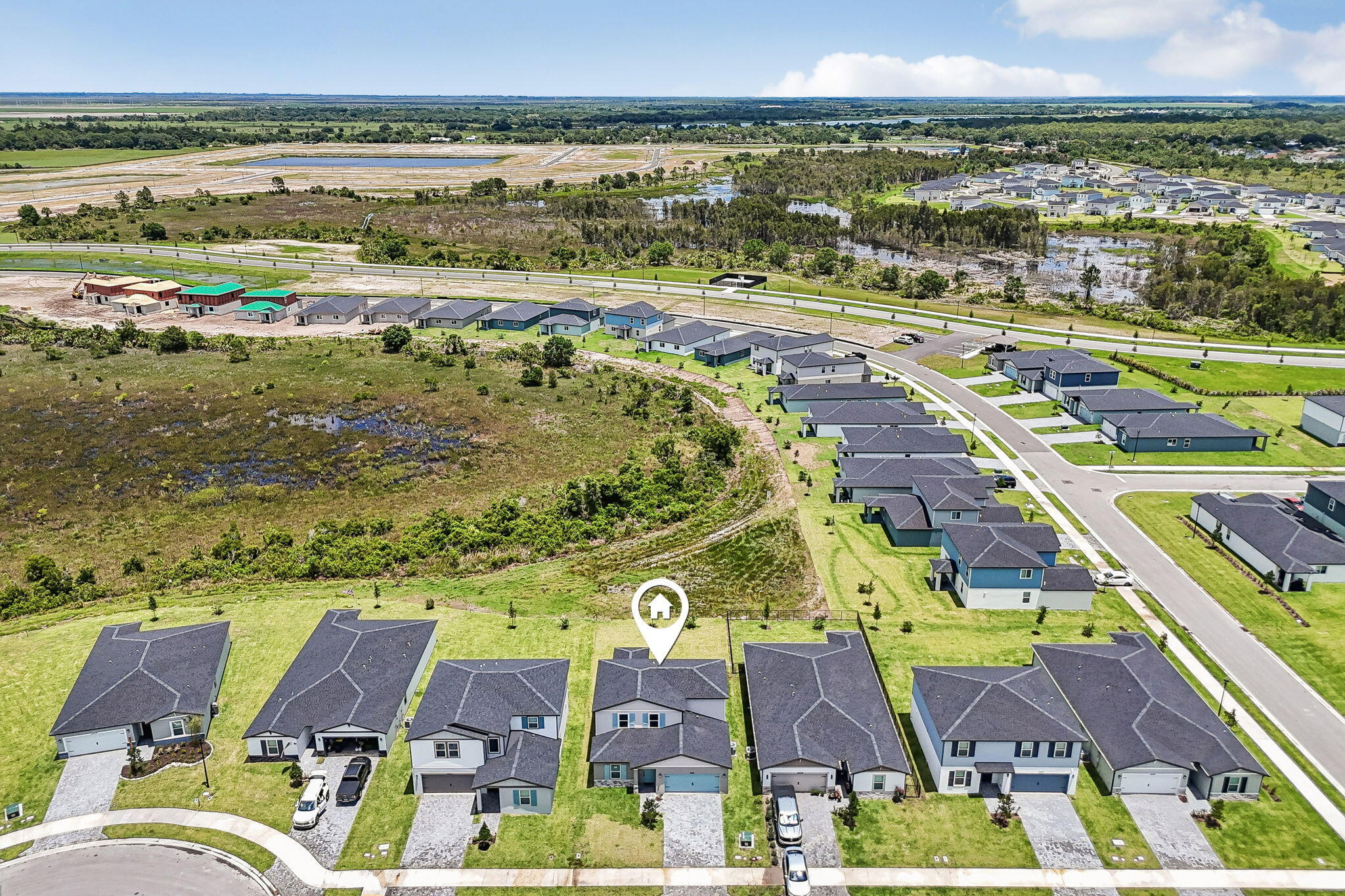 14211 Southwest New Dawn Road Indiantown, FL 34956 - Photo 32 of 37 an aerial view of residential houses with outdoor space