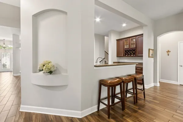 a view of kitchen with furniture and wooden floor