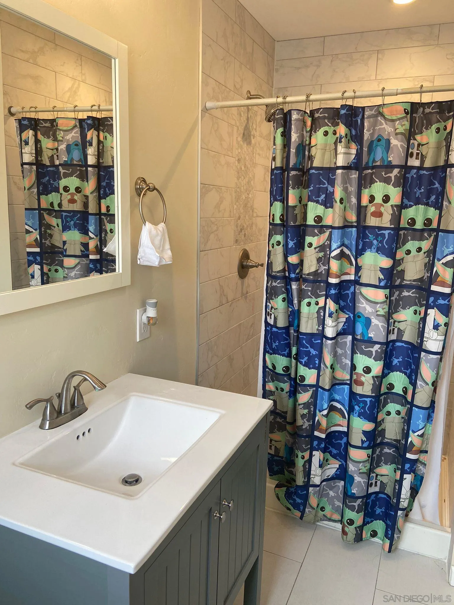 5442 San Onofre Terrace San Diego, CA 92114 - Photo 13 of 29 a bathroom with a sink and a shower