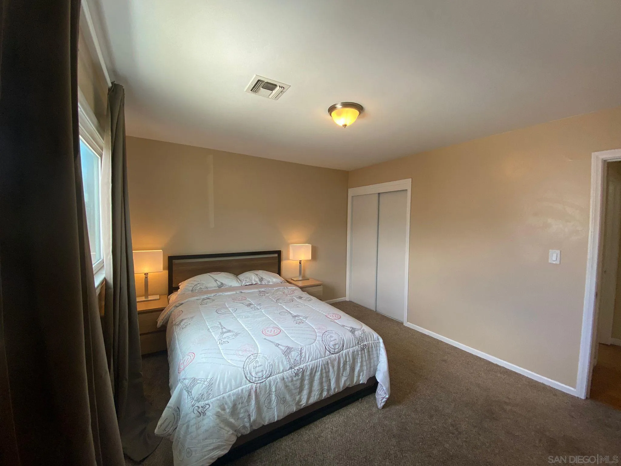 5442 San Onofre Terrace San Diego, CA 92114 - Photo 16 of 29 a bedroom with a bed and a window