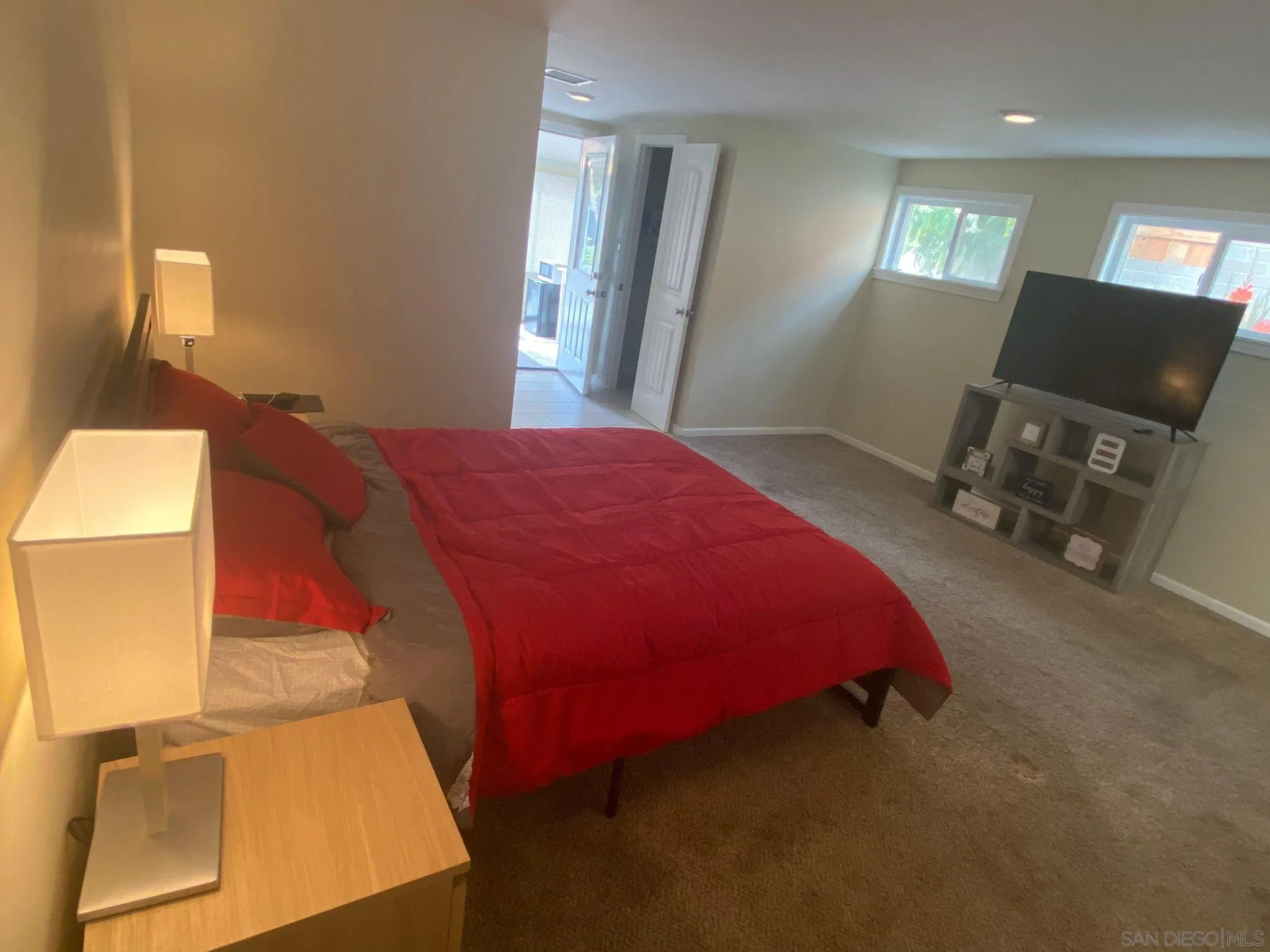 5442 San Onofre Terrace San Diego, CA 92114 - Photo 23 of 29 a bedroom with a bed and a flat tv screen on dresser