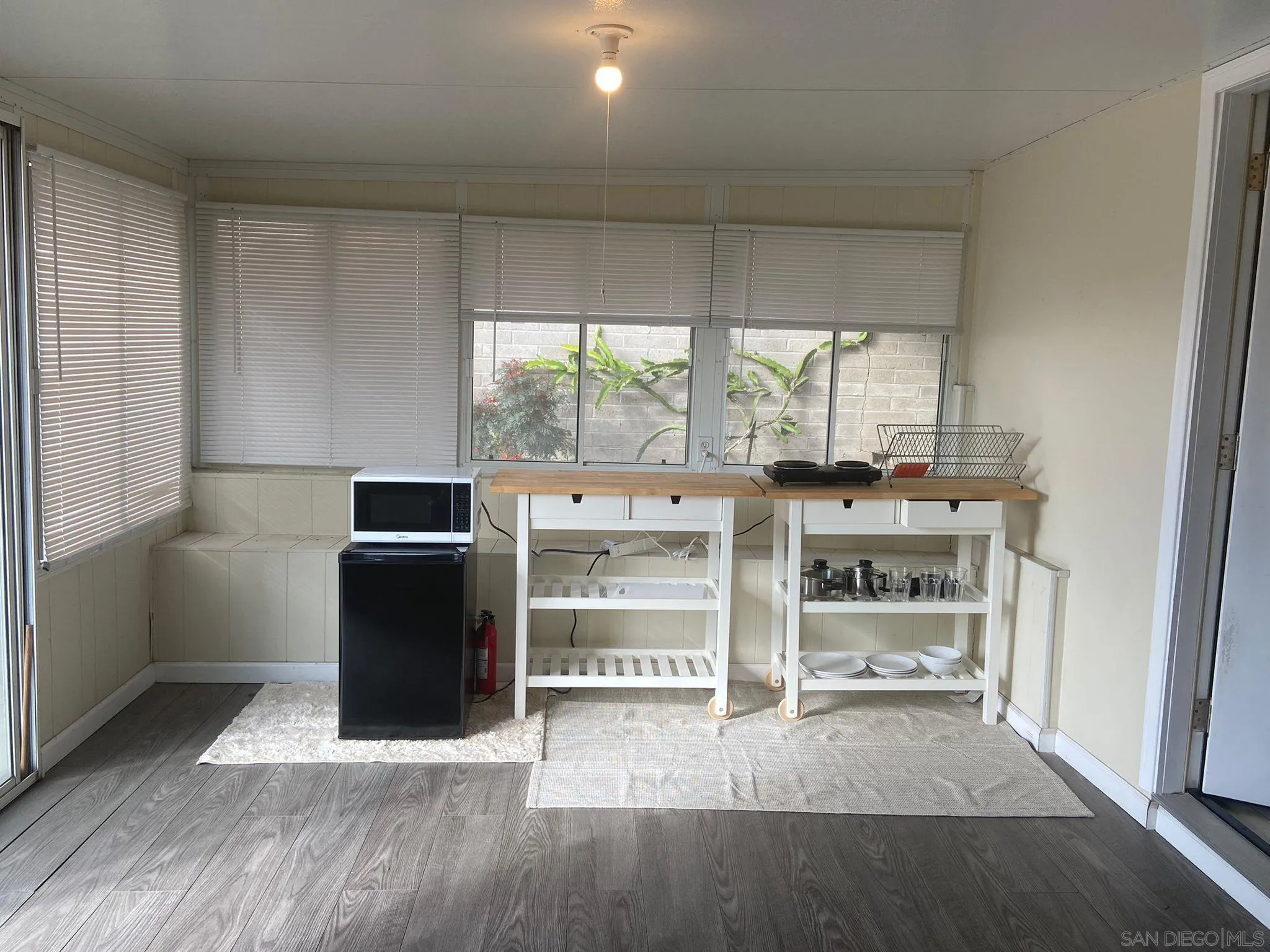 5442 San Onofre Terrace San Diego, CA 92114 - Photo 26 of 29 a view of a kitchen with fridge and wooden floor