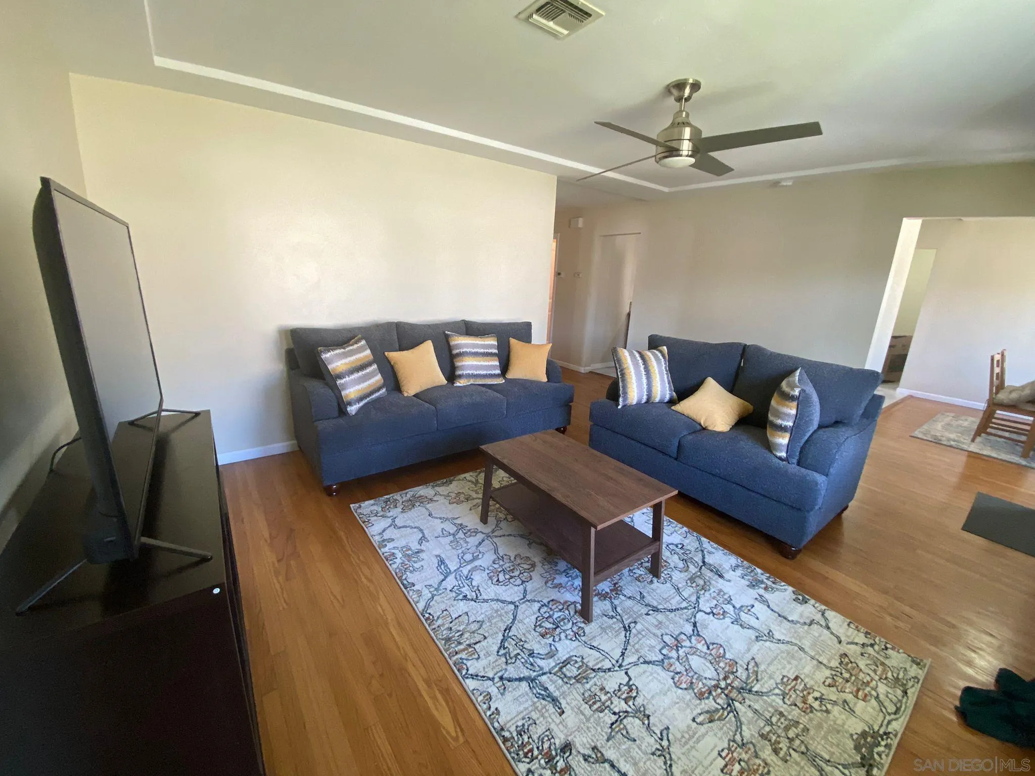5442 San Onofre Terrace San Diego, CA 92114 - Photo 3 of 29 a living room with furniture and a rug