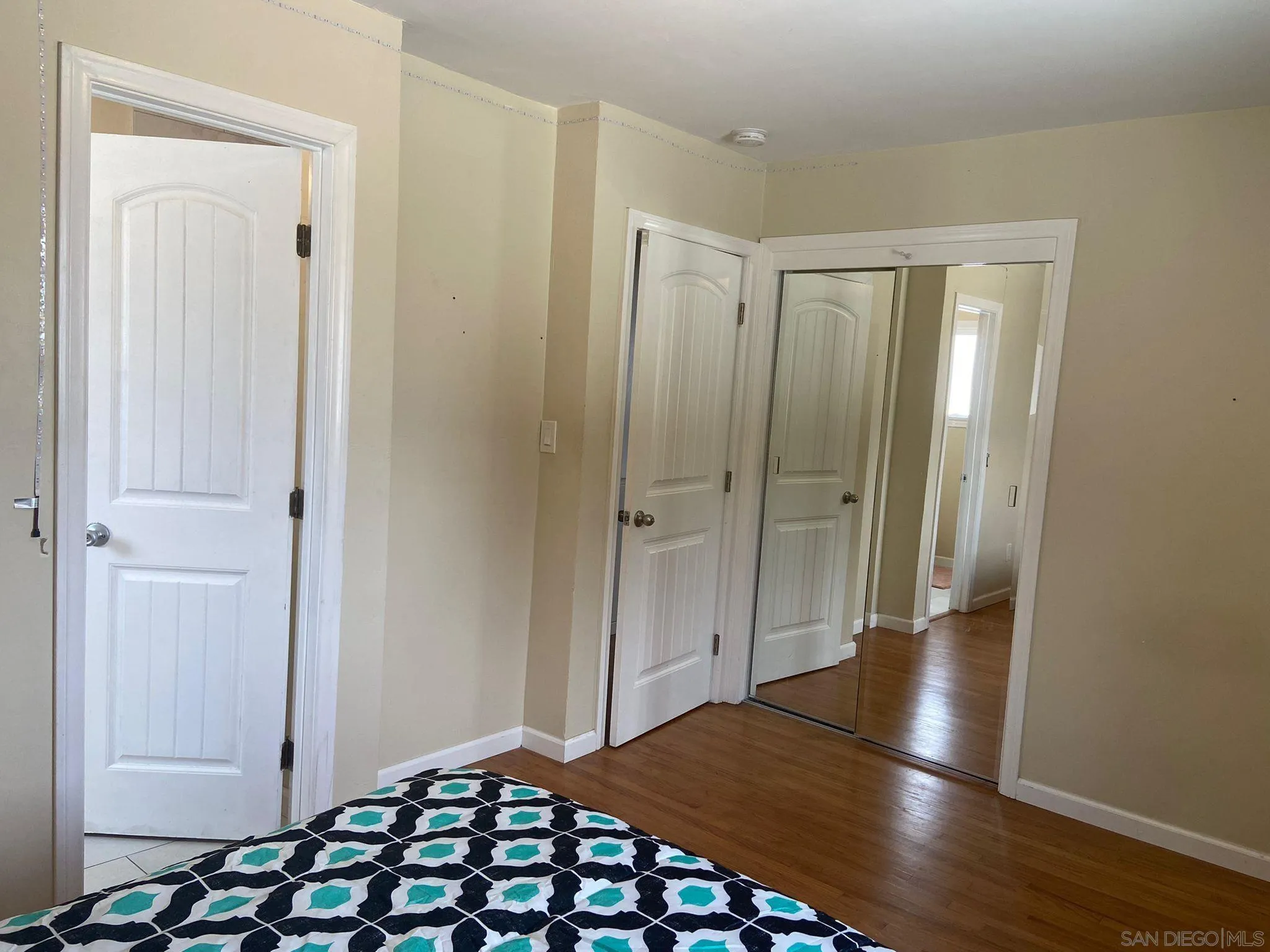 5442 San Onofre Terrace San Diego, CA 92114 - Photo 9 of 29 a view of a hallway with wooden floor