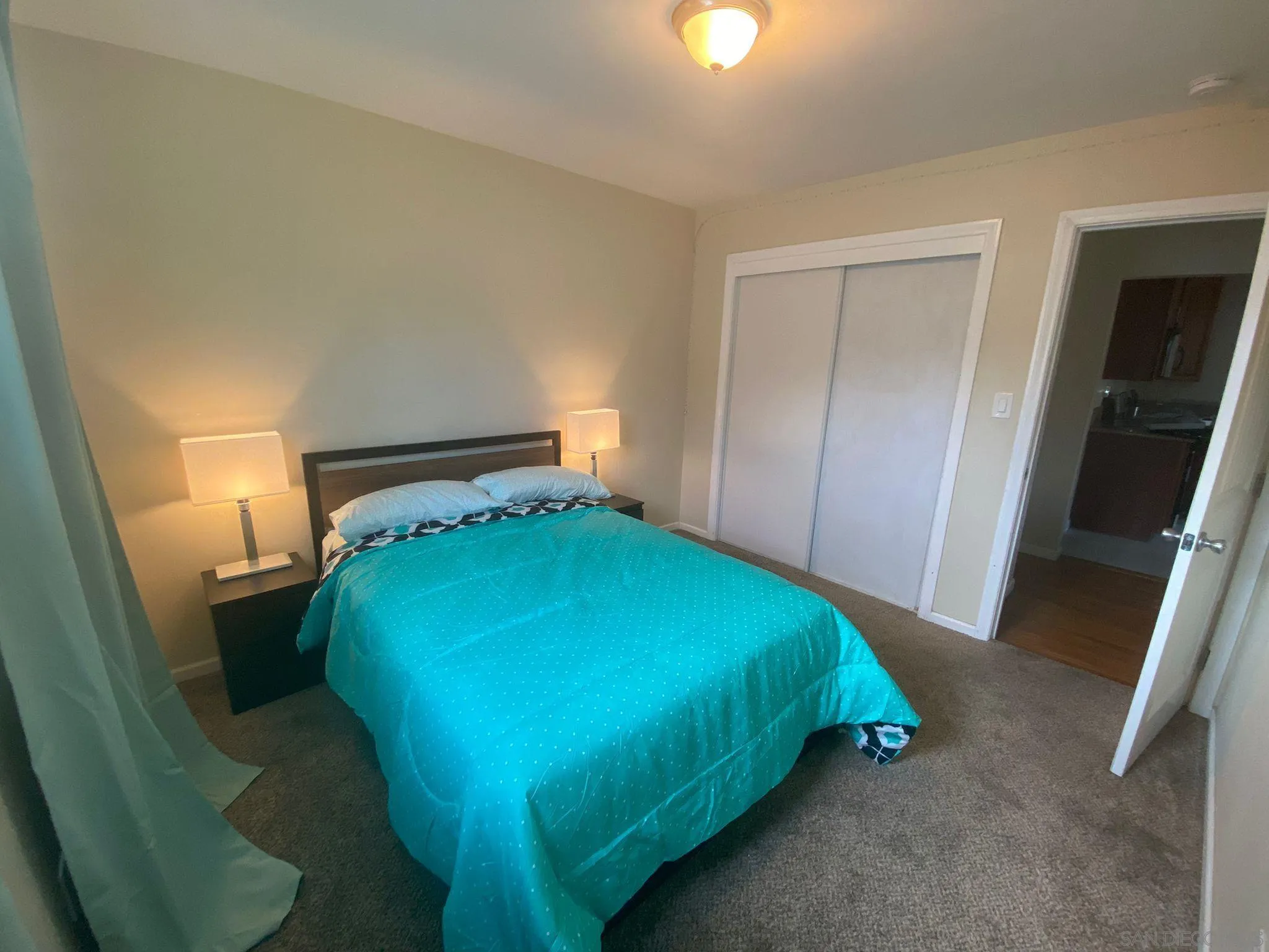 5442 San Onofre Terrace San Diego, CA 92114 - Photo 10 of 29 a bedroom with a bed and a mirror