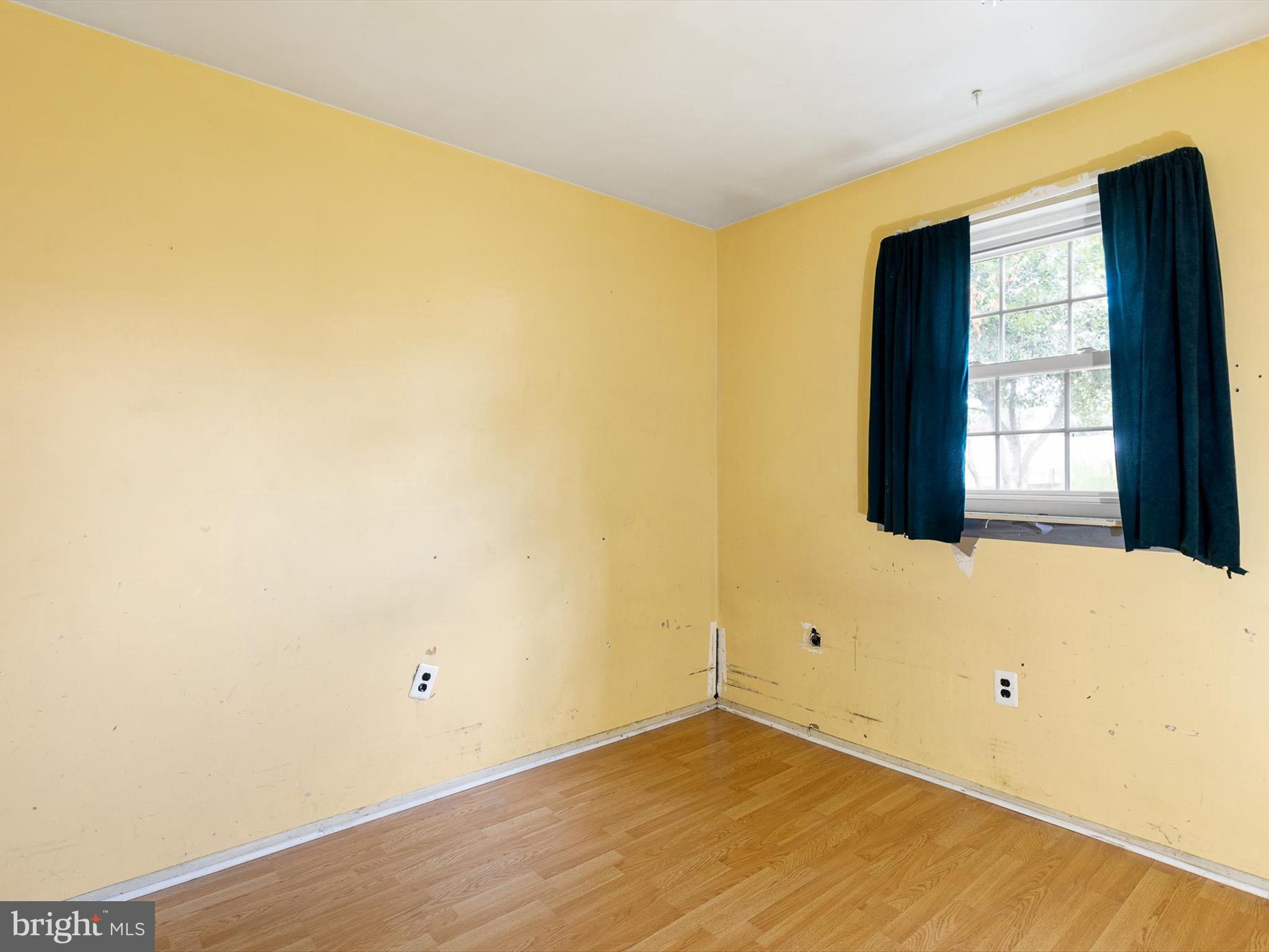 5 Topaz Drive Newark, DE 19702 - Photo 18 of 28 a view of an empty room with wooden floor and a window