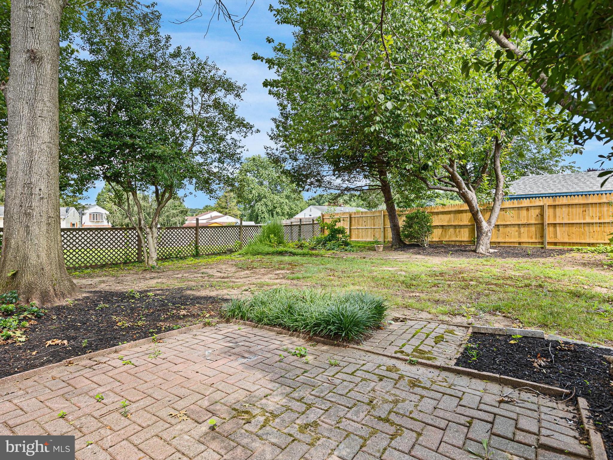 5 Topaz Drive Newark, DE 19702 - Photo 23 of 28 a view of a yard with plants and large trees