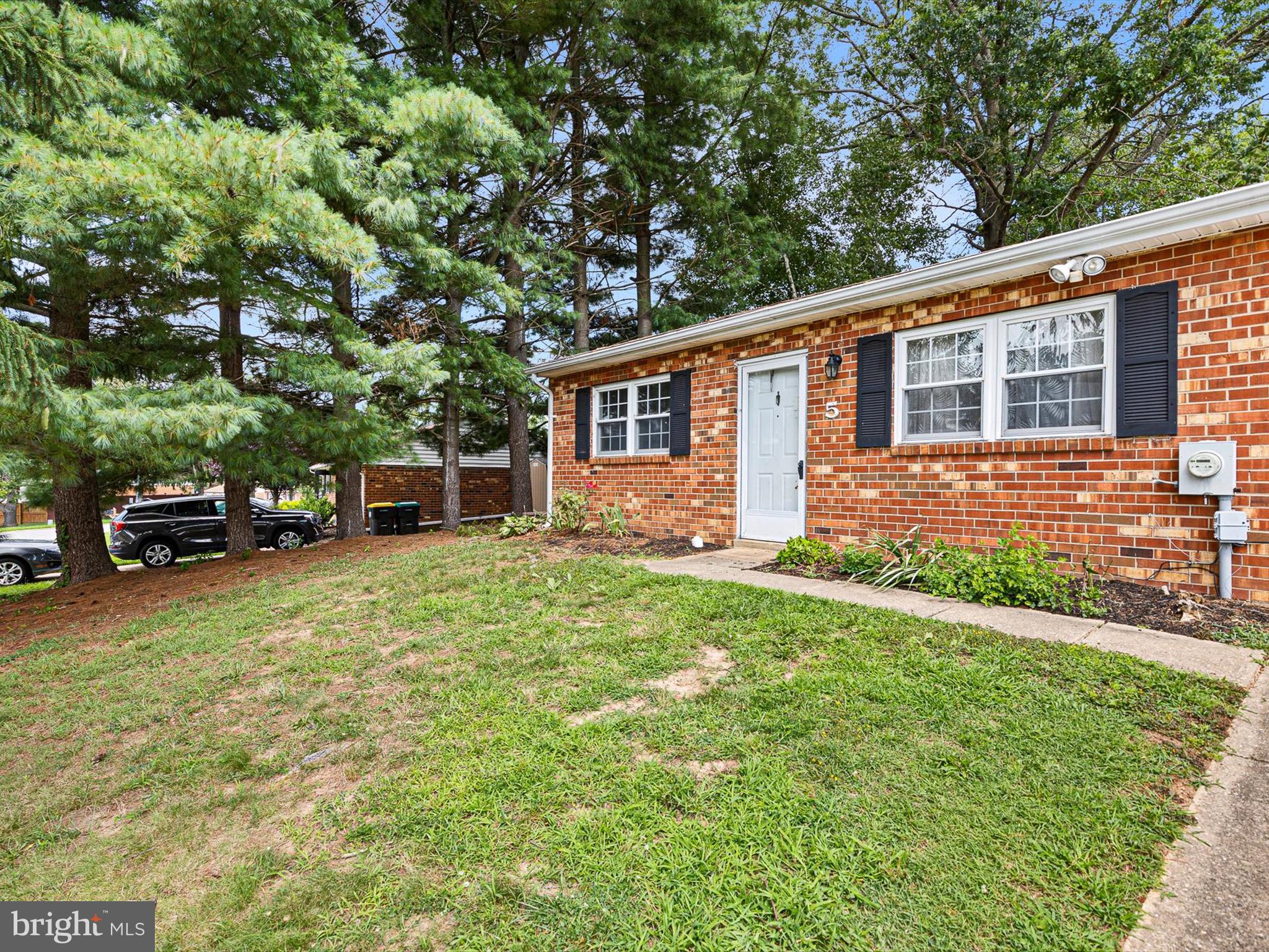 5 Topaz Drive Newark, DE 19702 - Photo 4 of 28 a front view of a house with a garden