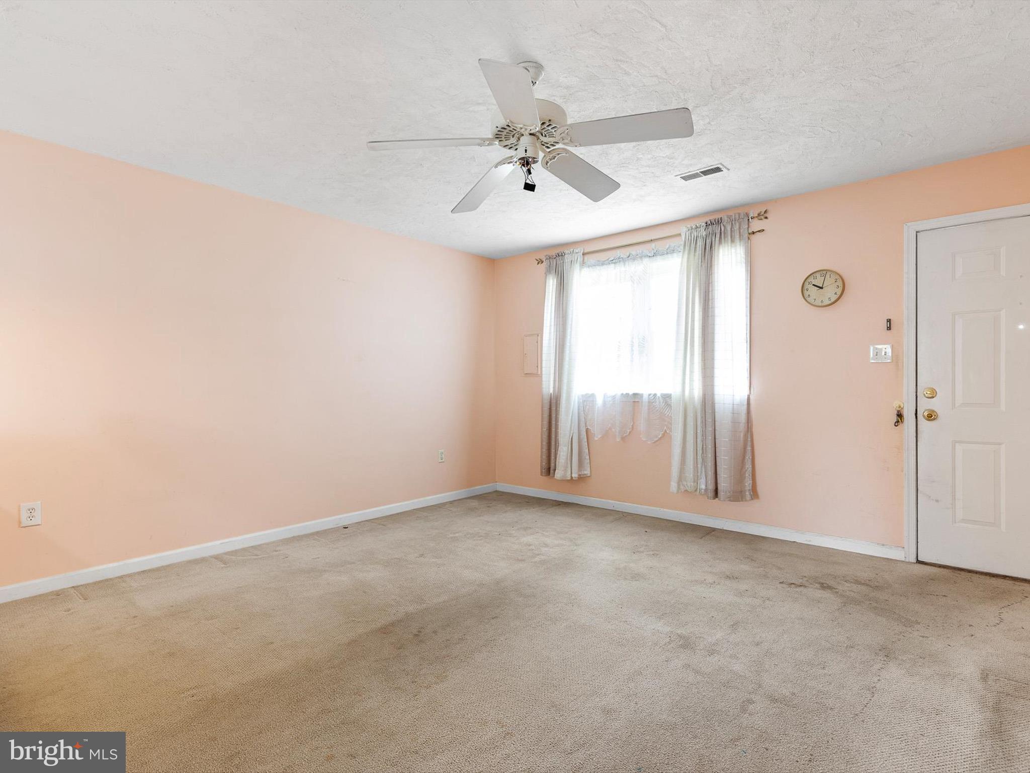 5 Topaz Drive Newark, DE 19702 - Photo 6 of 28 an empty room with windows and fan