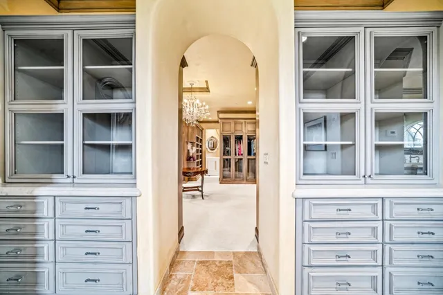 a bedroom with a bed and large window
