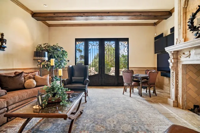a bedroom with a large bed and a large window