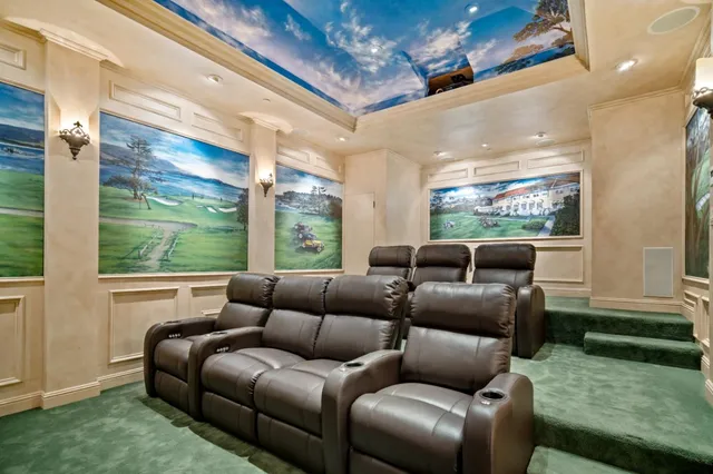 a bedroom with furniture and a large window