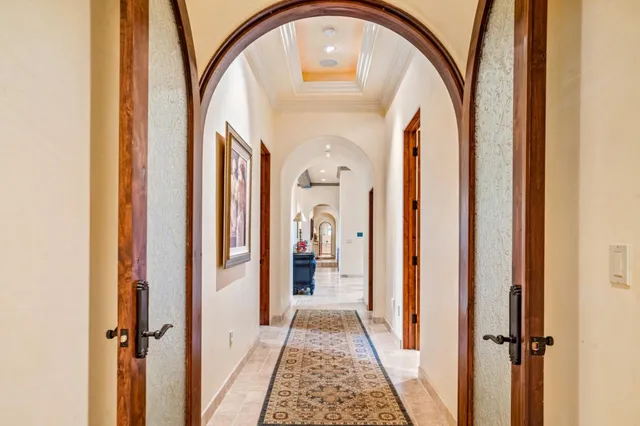 a bathroom with a granite countertop shower a mirror and a sink