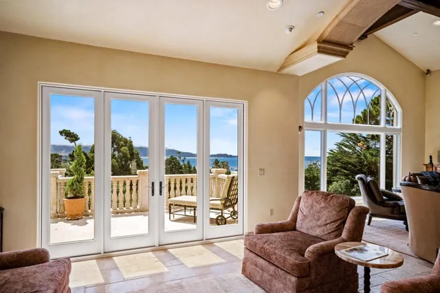 a view of a balcony with furniture