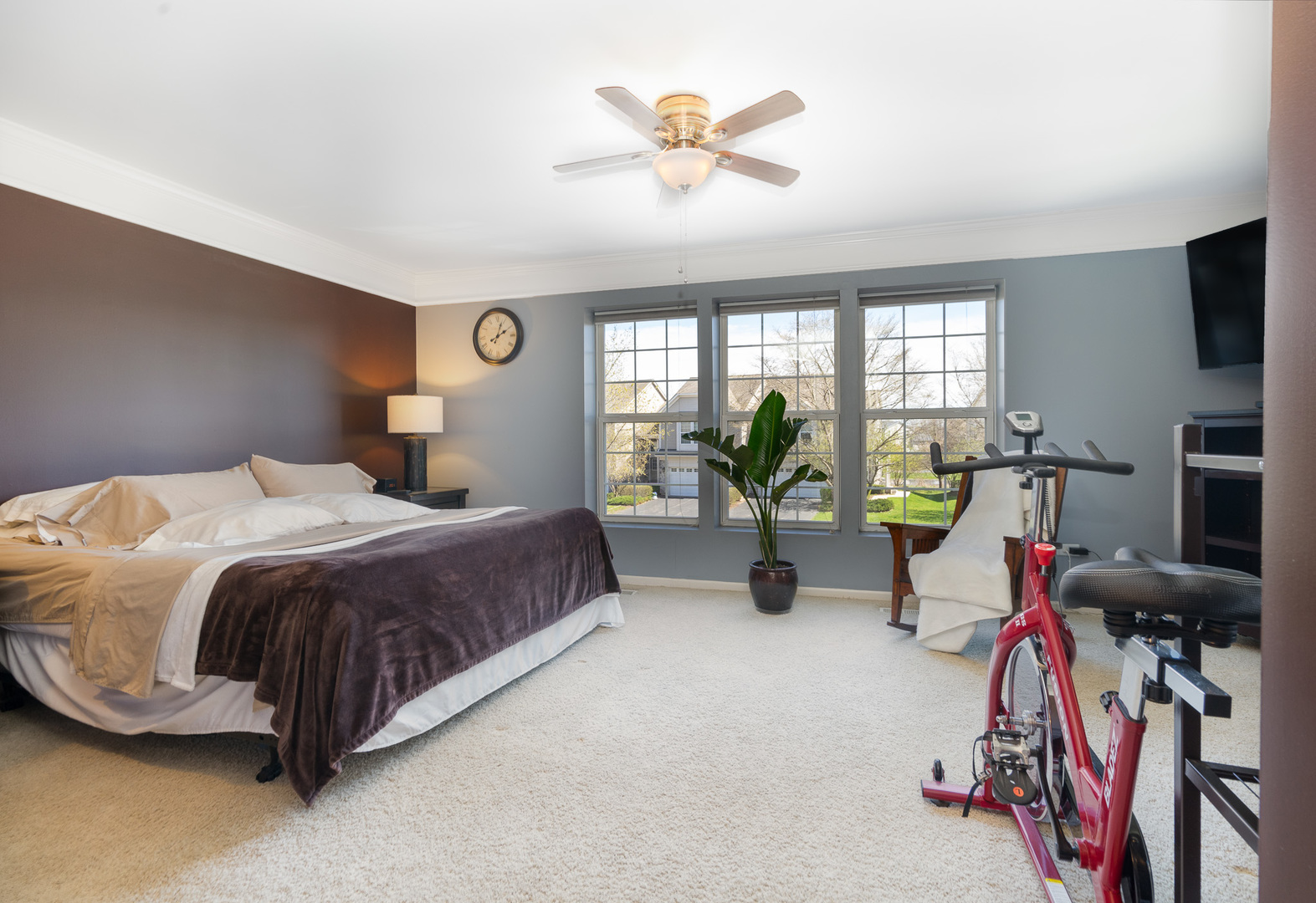 15316 Pinewood Road Lockport, IL 60441 - Photo 17 of 31 a spacious bedroom with a bed and a chandelier