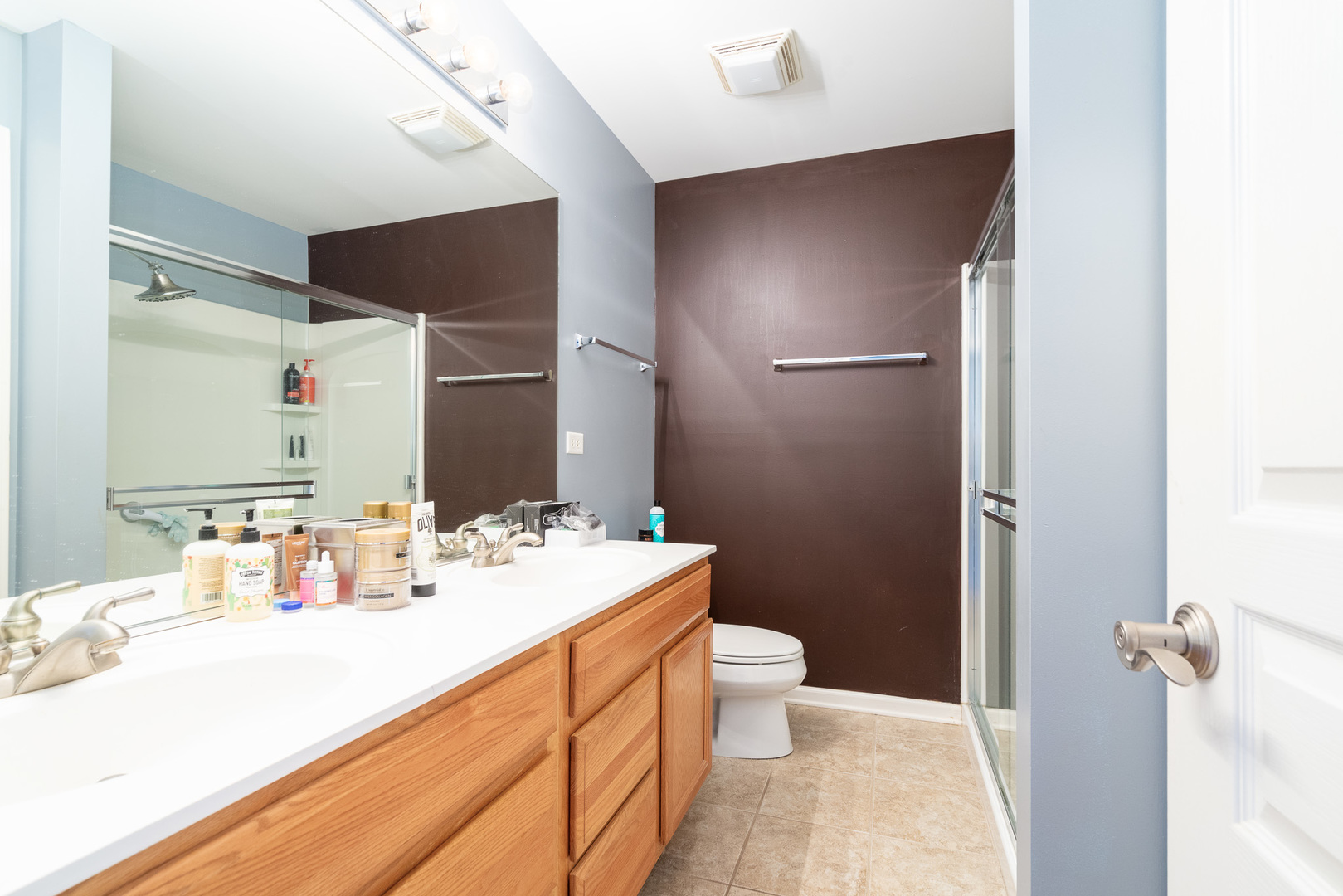15316 Pinewood Road Lockport, IL 60441 - Photo 19 of 31 a bathroom with a sink and a mirror
