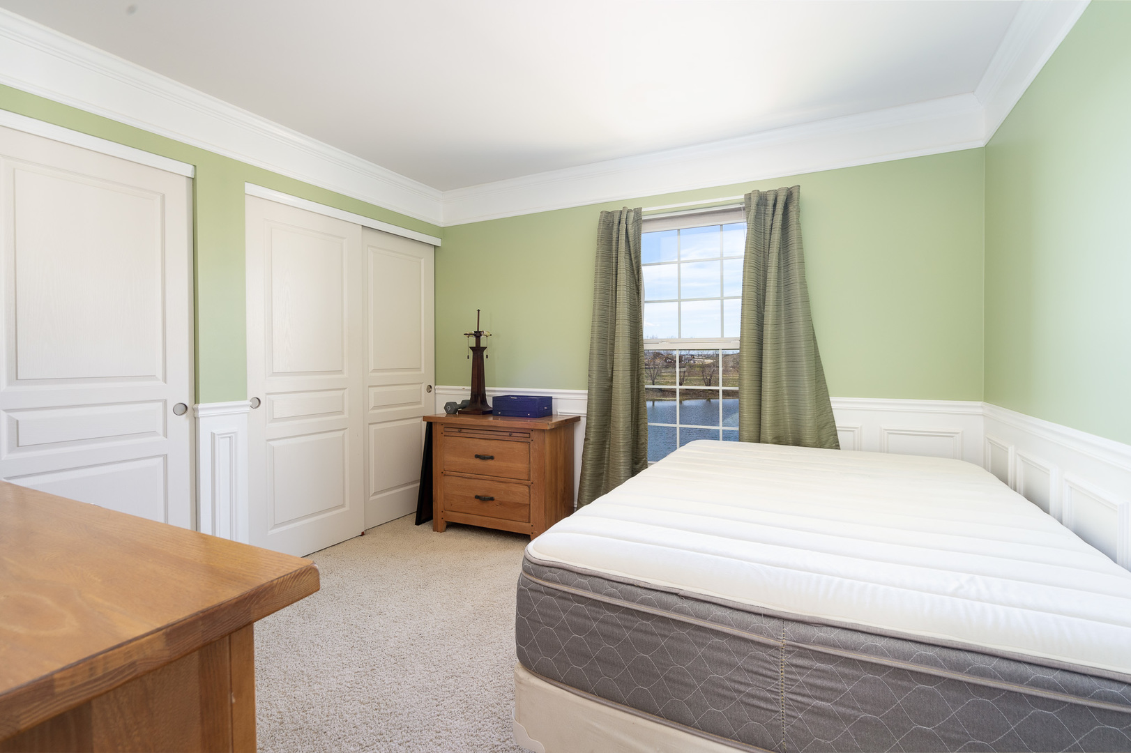 15316 Pinewood Road Lockport, IL 60441 - Photo 24 of 31 a bedroom with a bed and a dresser