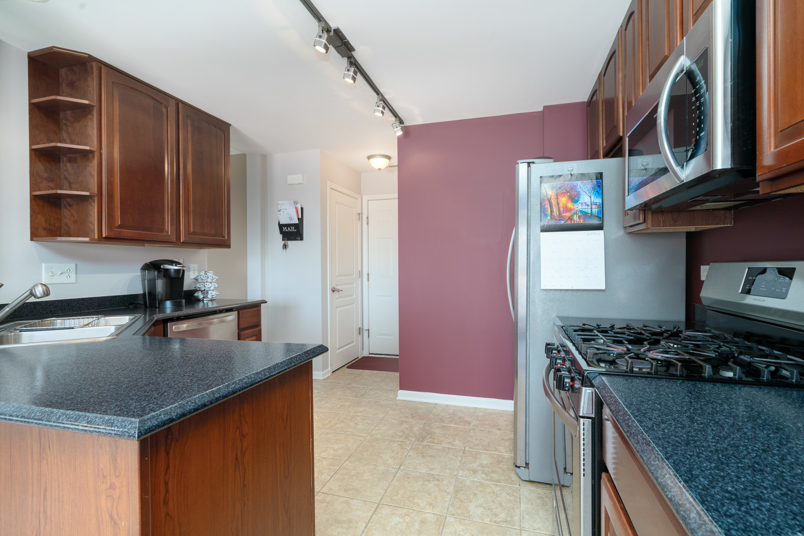 15316 Pinewood Road Lockport, IL 60441 - Photo 9 of 31 a kitchen with stainless steel appliances granite countertop a stove and a sink