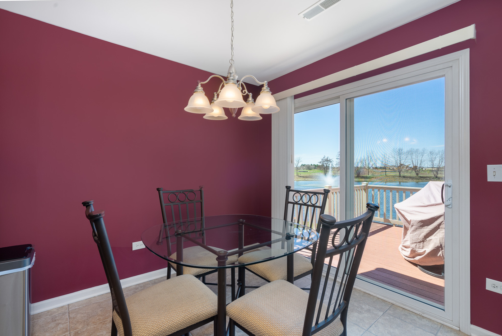 15316 Pinewood Road Lockport, IL 60441 - Photo 10 of 31 a view of a dining room with furniture wooden floor and chandelier