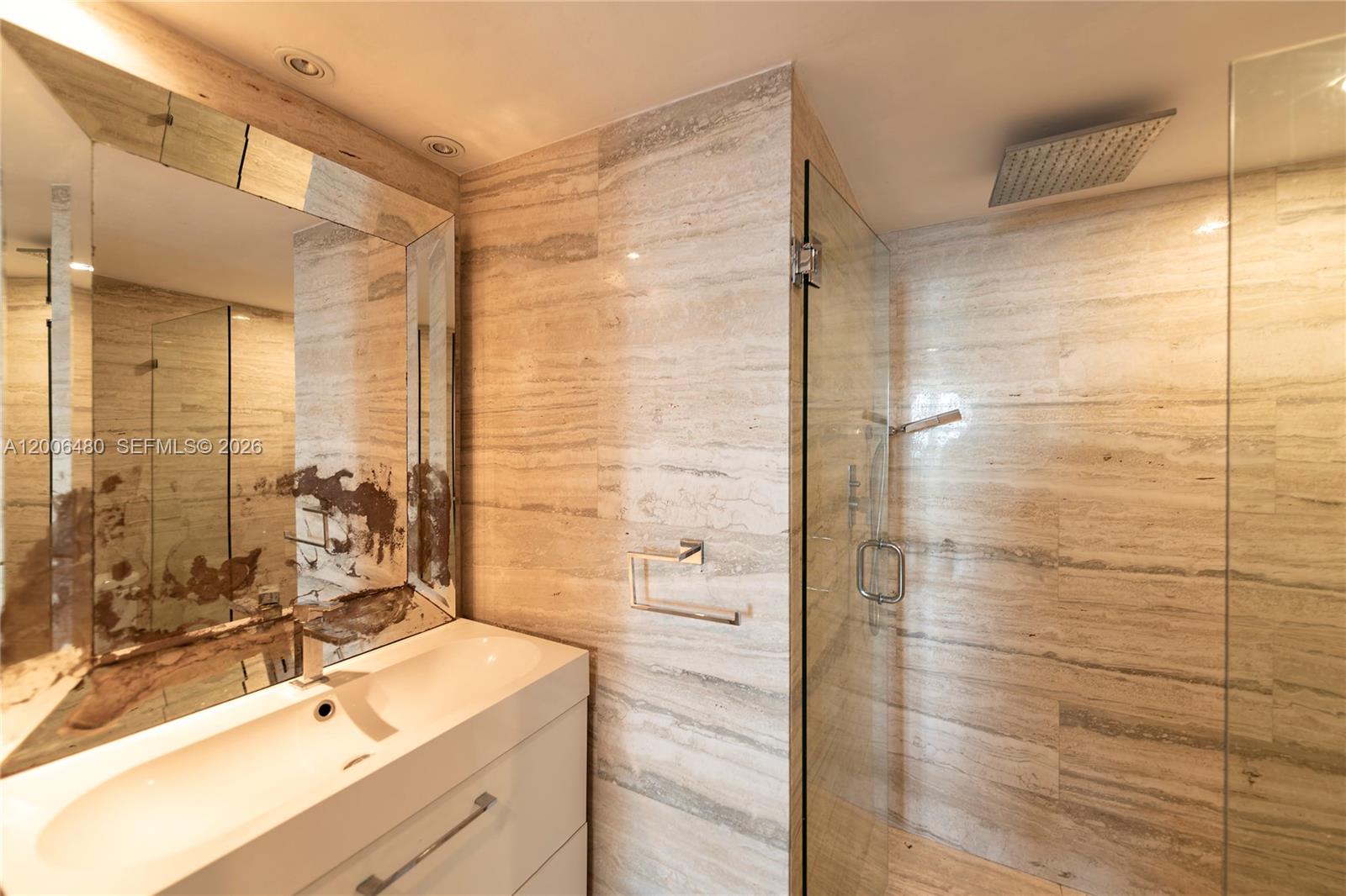 90 Alton Road, Unit 2304 Miami Beach, FL 33139 - Photo 9 of 16 a bathroom with a shower and a sink