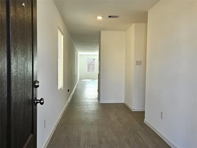 a view of hallway with livingroom