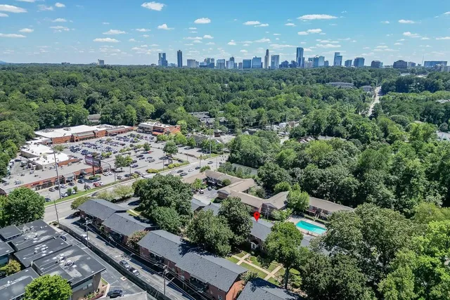an aerial view of multiple houses with yard