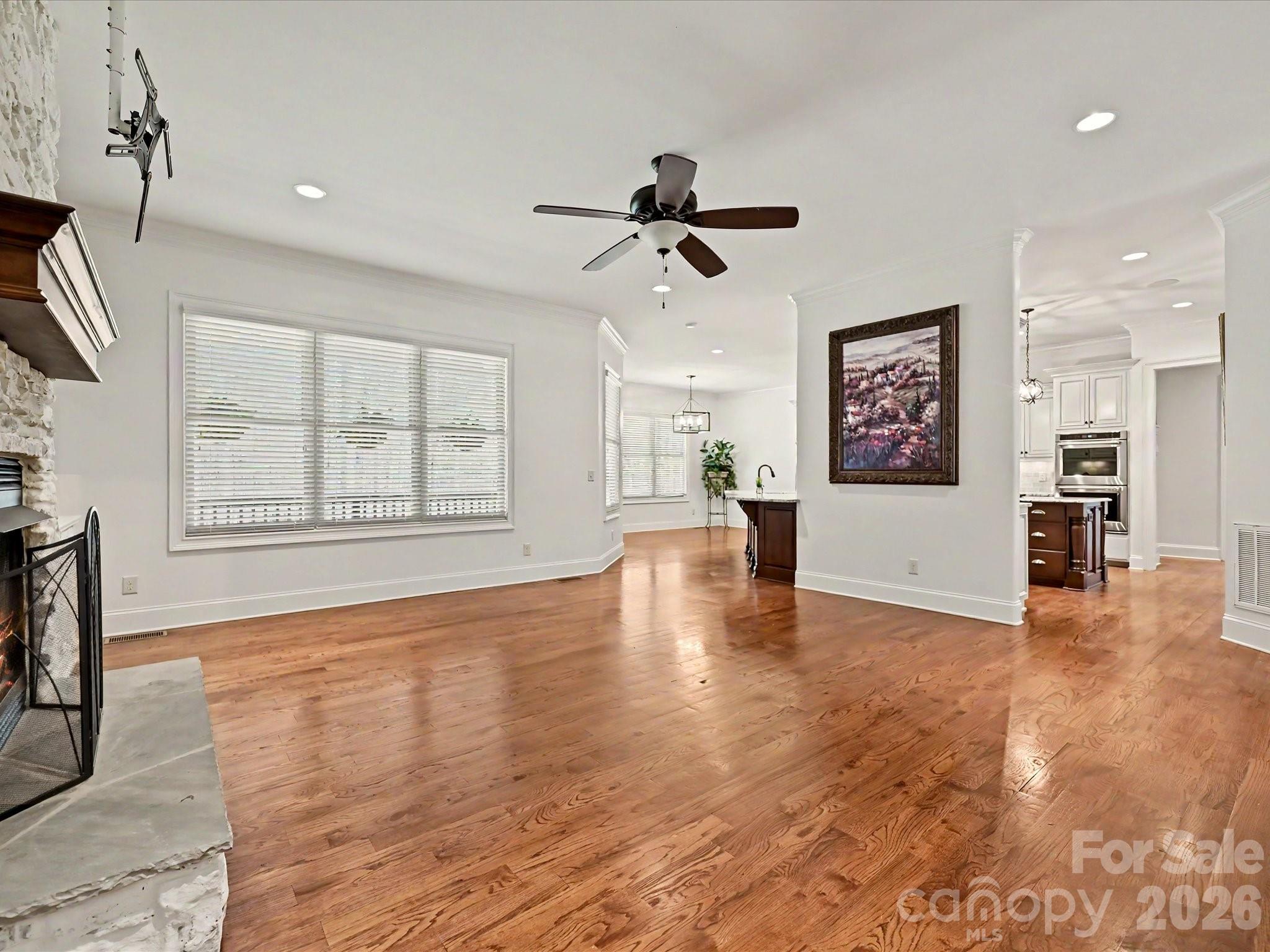 280 Palm Cove Way York, SC 29745 - Photo 14 of 48 a view of an empty room with a window and wooden floor