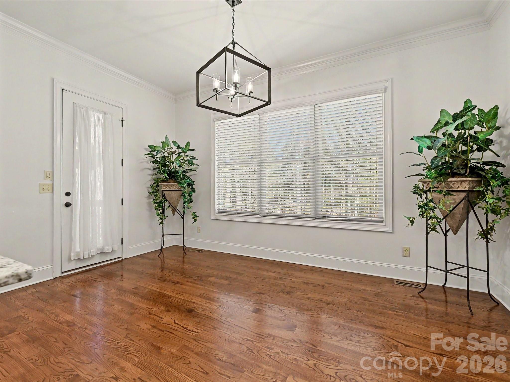 280 Palm Cove Way York, SC 29745 - Photo 19 of 48 a view of an empty room with a window and wooden floor