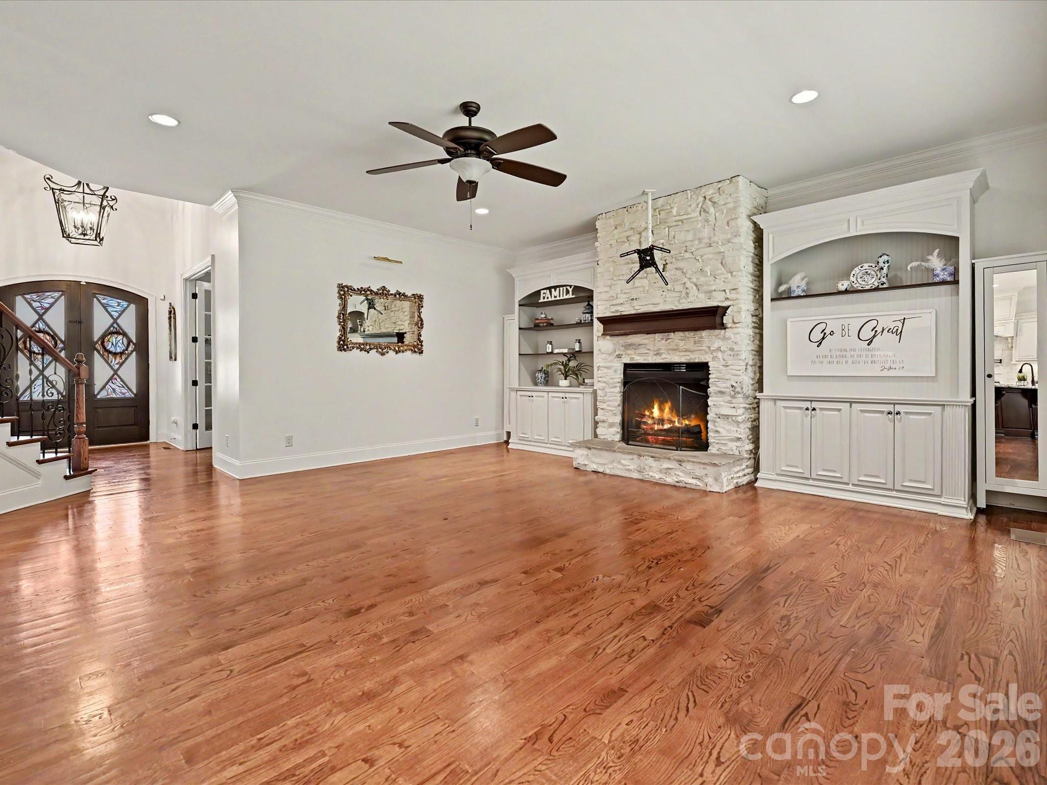 280 Palm Cove Way York, SC 29745 - Photo 21 of 48 a view of a livingroom with a fireplace cabinet and windows