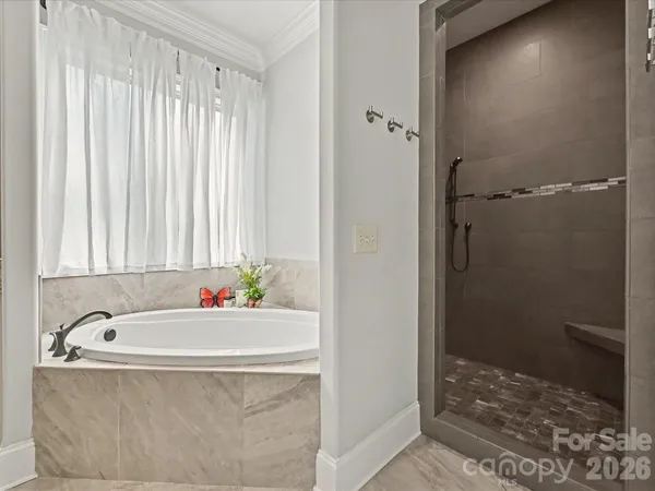 a bathroom with a double vanity sink and mirror