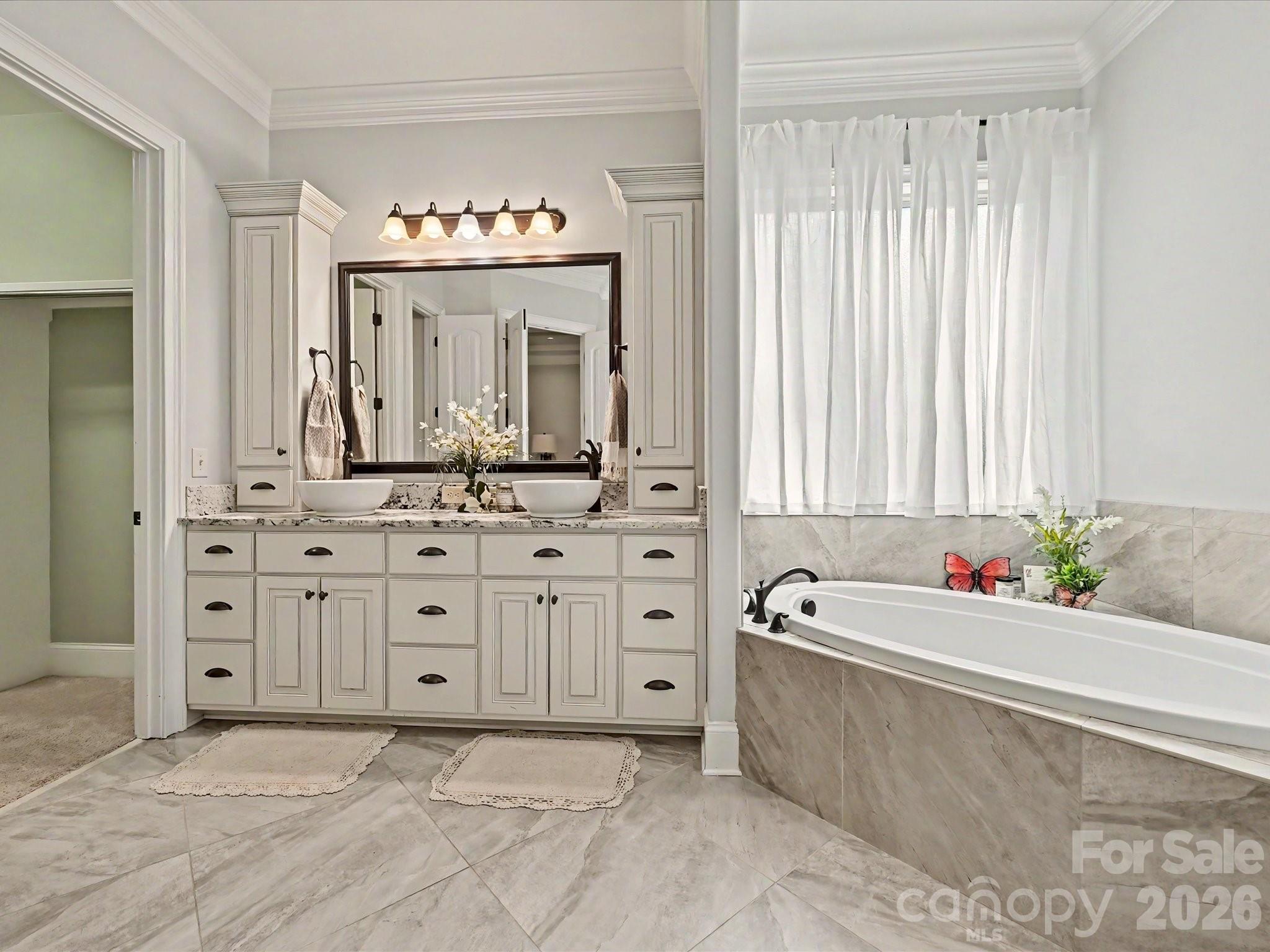 280 Palm Cove Way York, SC 29745 - Photo 27 of 48 a spacious bathroom with a tub sink and a mirror