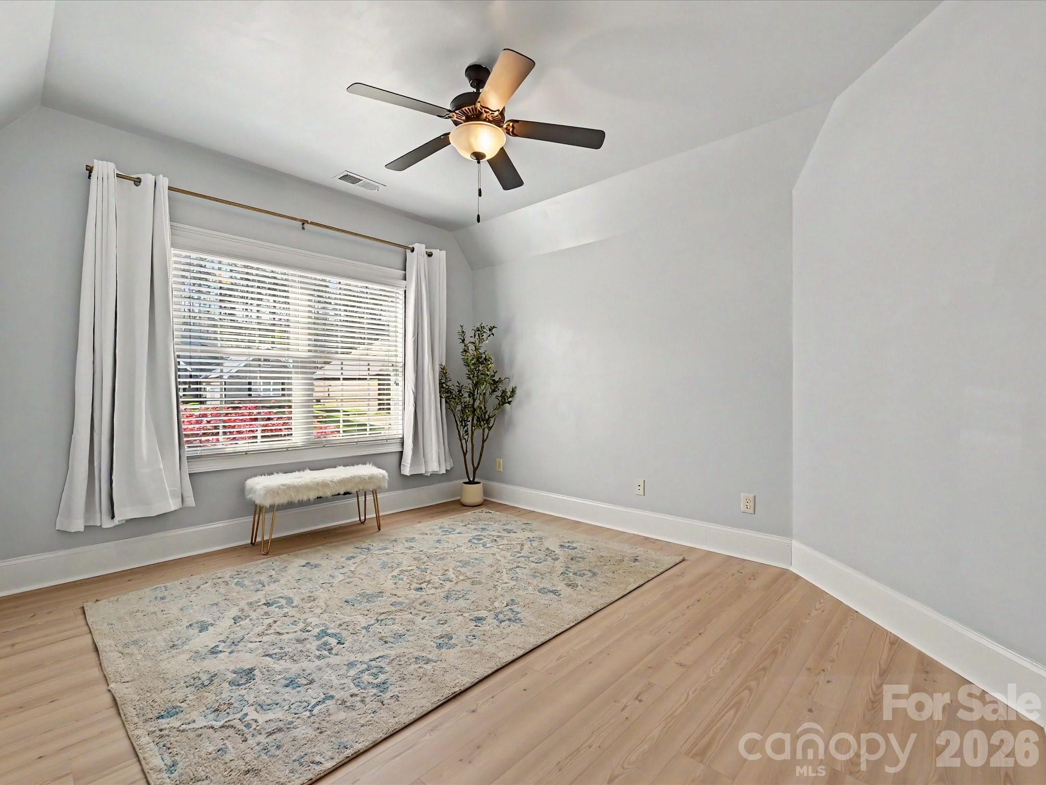 280 Palm Cove Way York, SC 29745 - Photo 39 of 48 an empty room with chandelier fan and windows