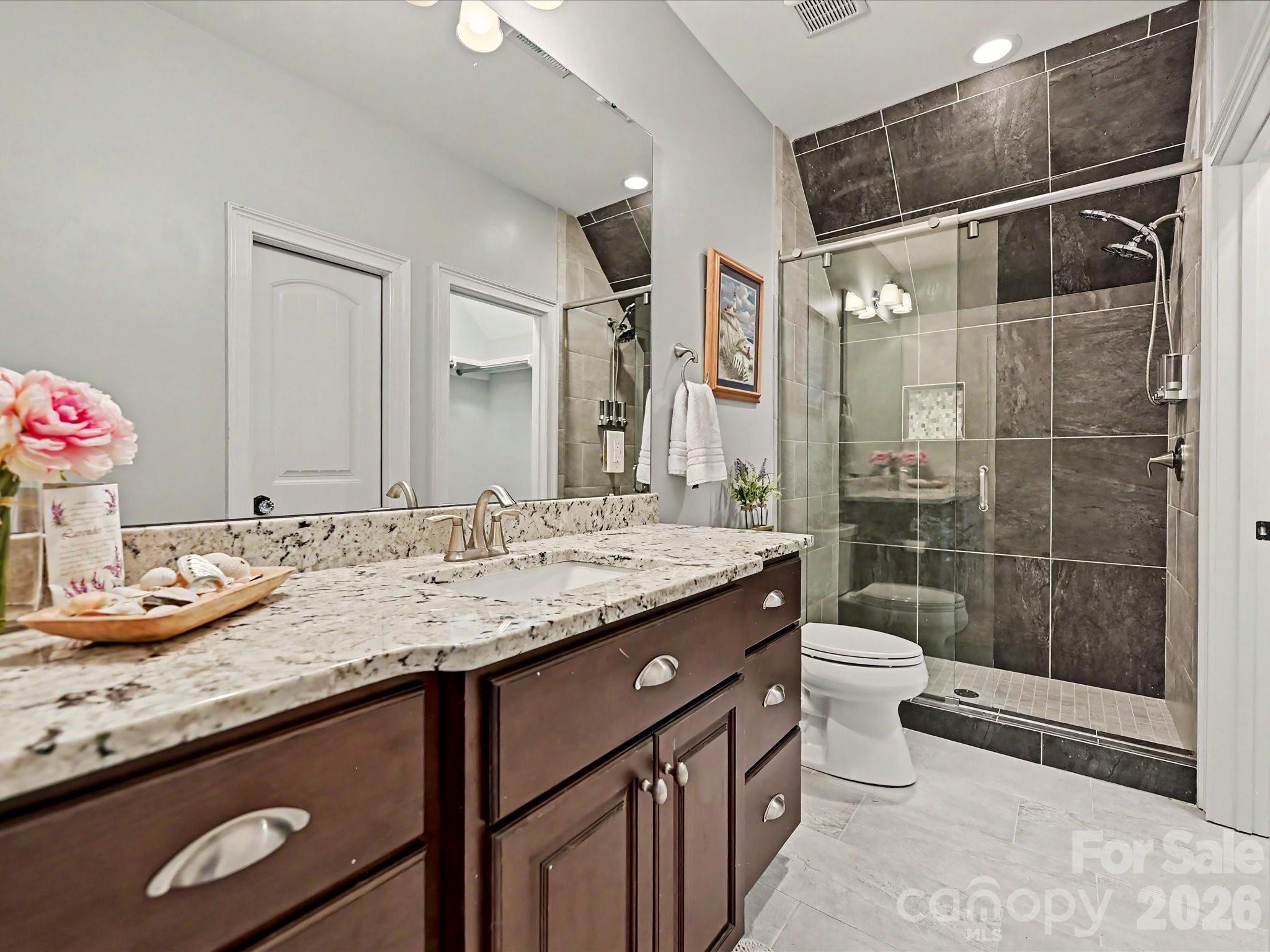 280 Palm Cove Way York, SC 29745 - Photo 40 of 48 a bathroom with a granite countertop sink toilet and shower