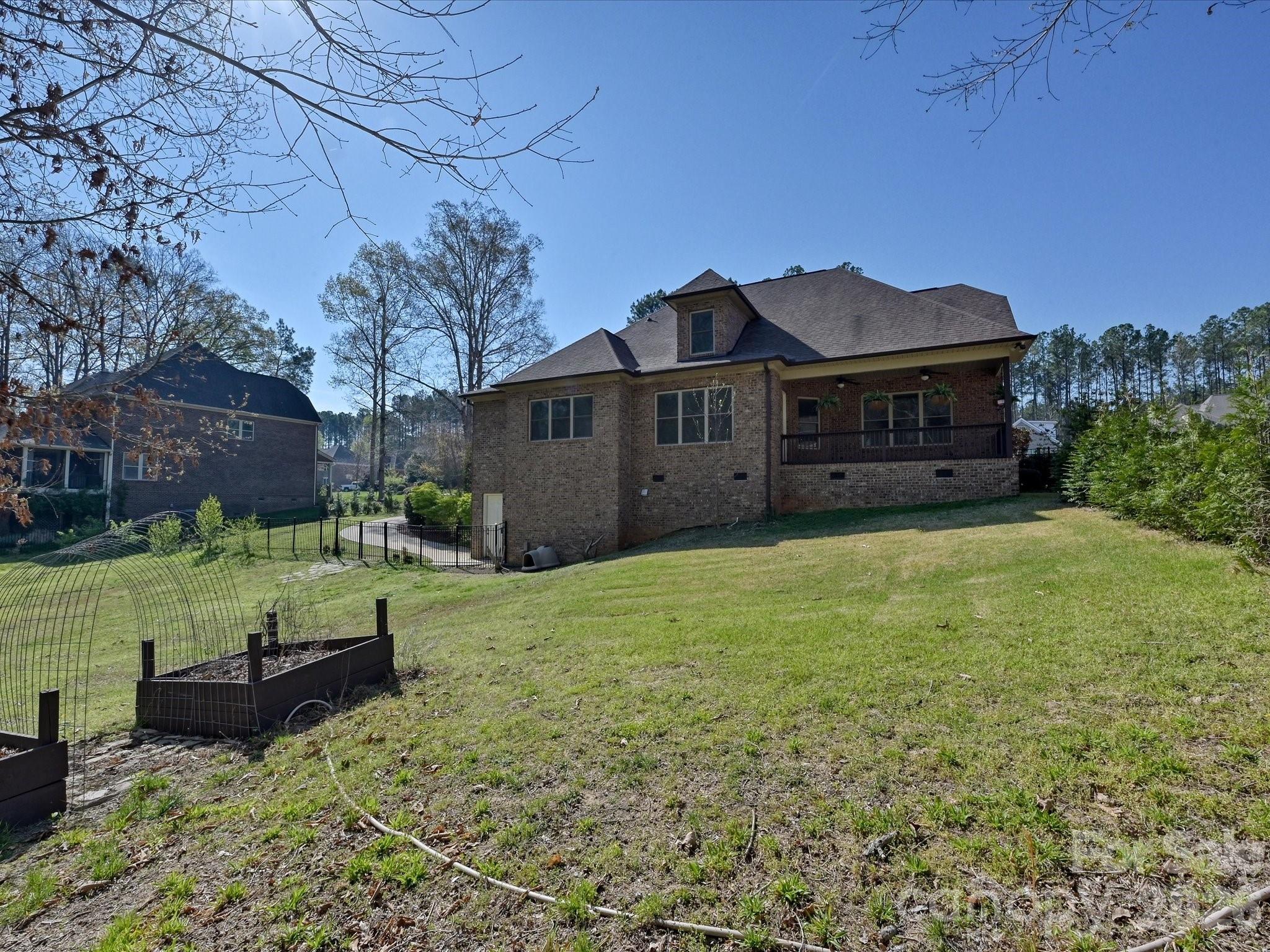 280 Palm Cove Way York, SC 29745 - Photo 47 of 48 a view of a big house with a big yard and large tree
