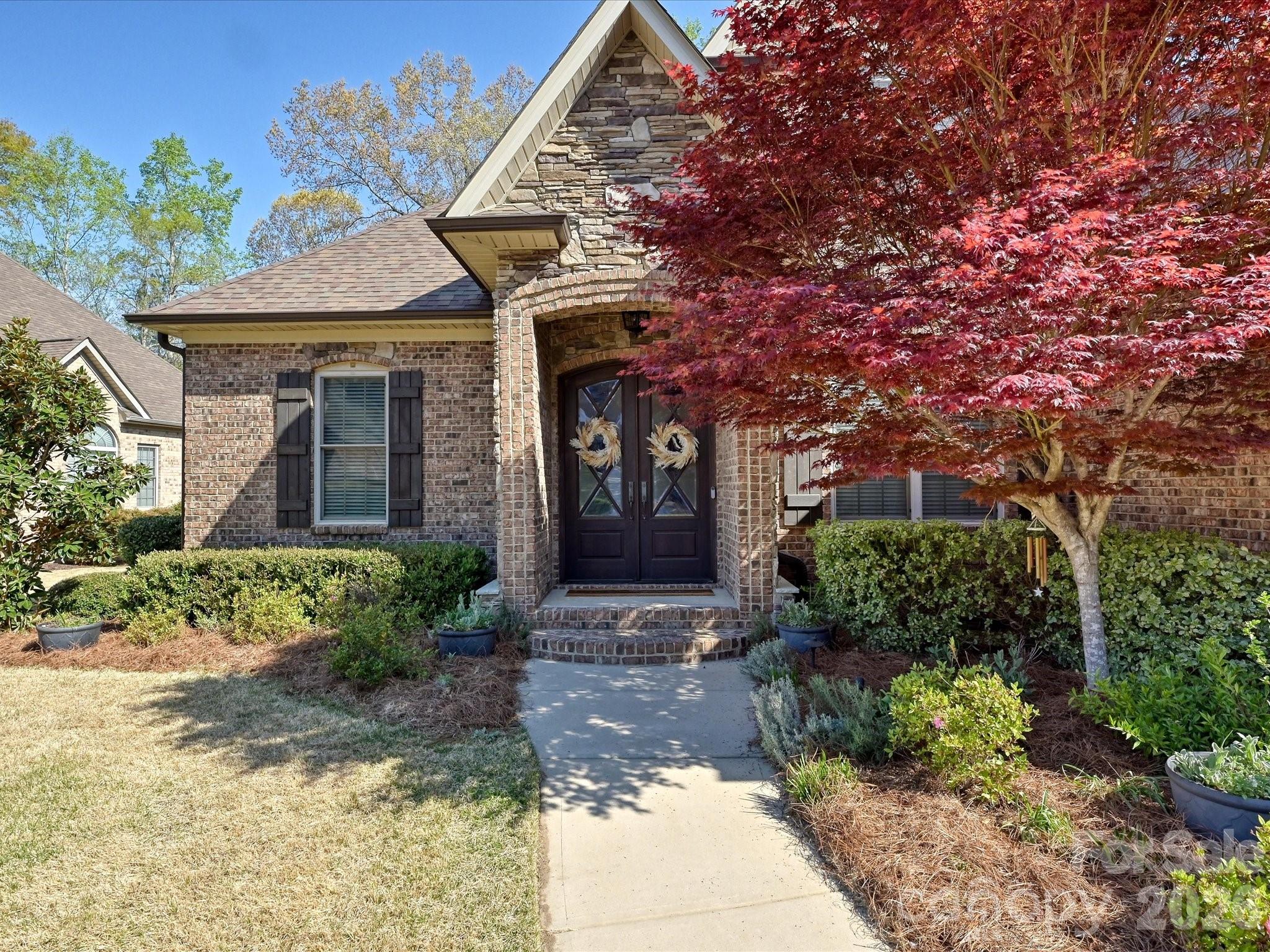 280 Palm Cove Way York, SC 29745 - Photo 5 of 48 a front view of a house with garden