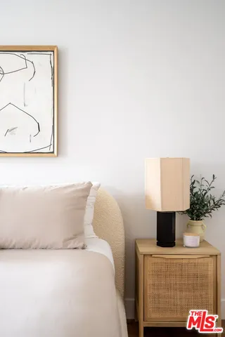 a bathroom with a bathtub and a potted plant