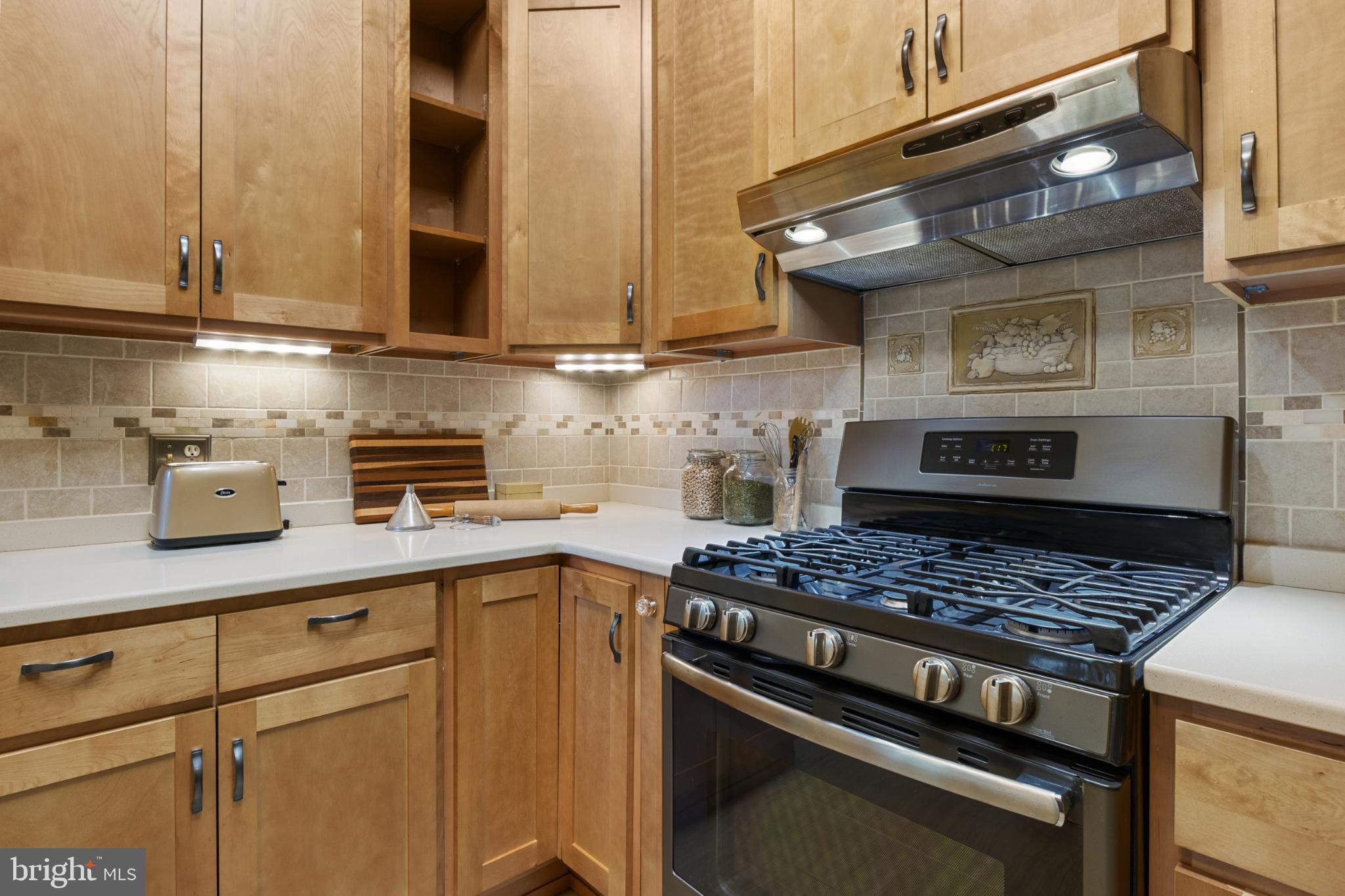 721 South George Street York, PA 17401 - Photo 24 of 78 a kitchen with stainless steel appliances granite countertop a stove and a microwave