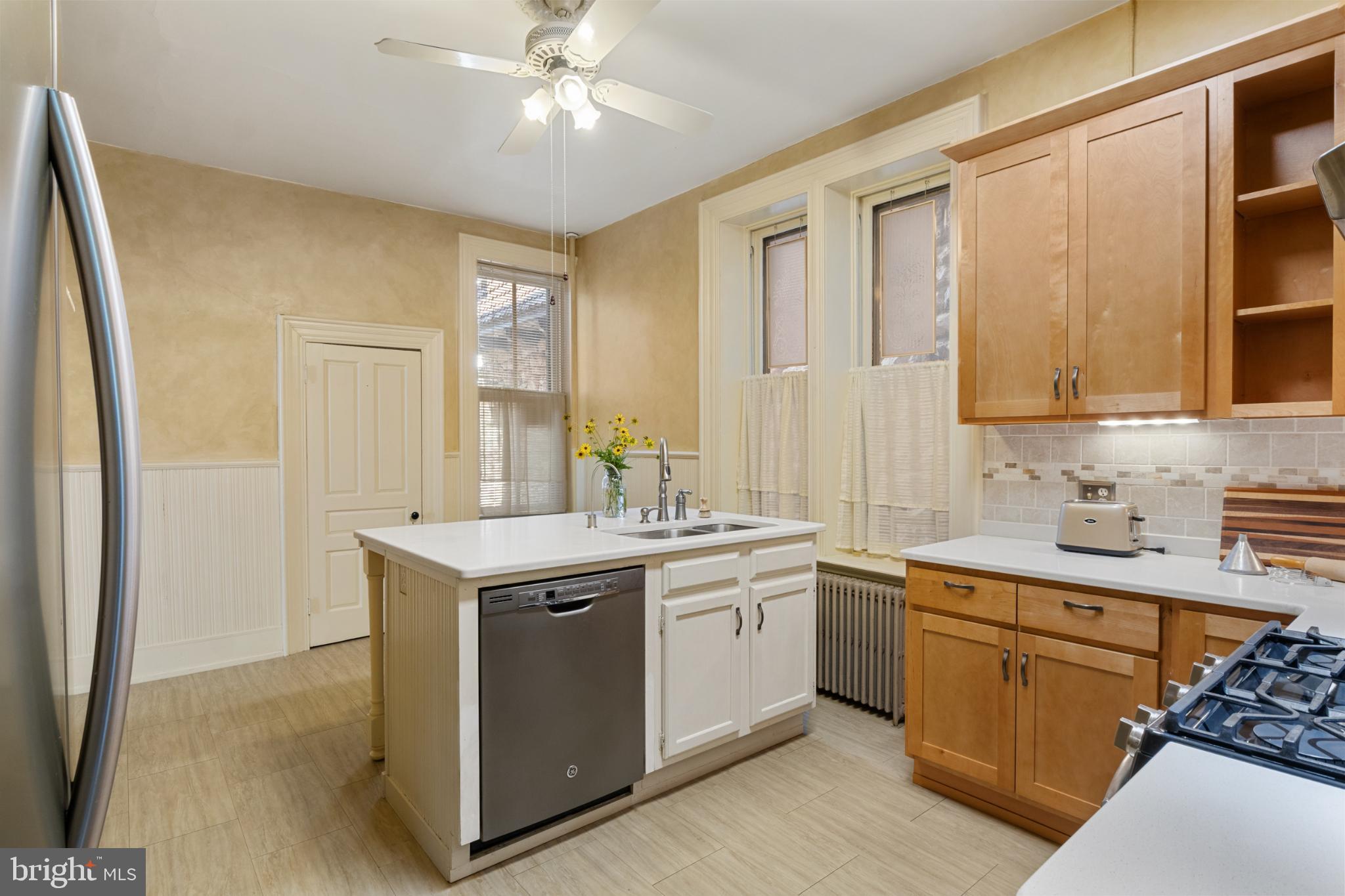 721 South George Street York, PA 17401 - Photo 25 of 78 a kitchen with a sink stove and cabinets