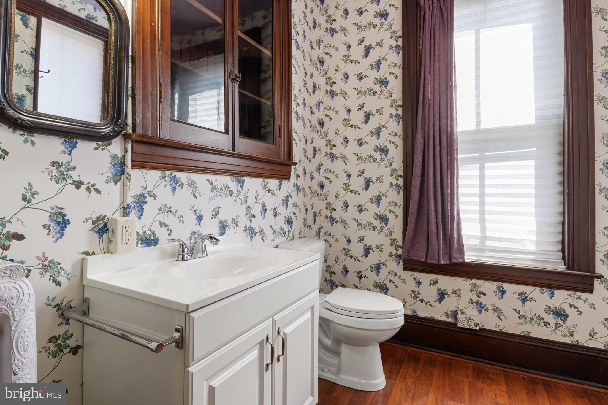 721 South George Street York, PA 17401 - Photo 34 of 78 a bathroom with a sink and a mirror