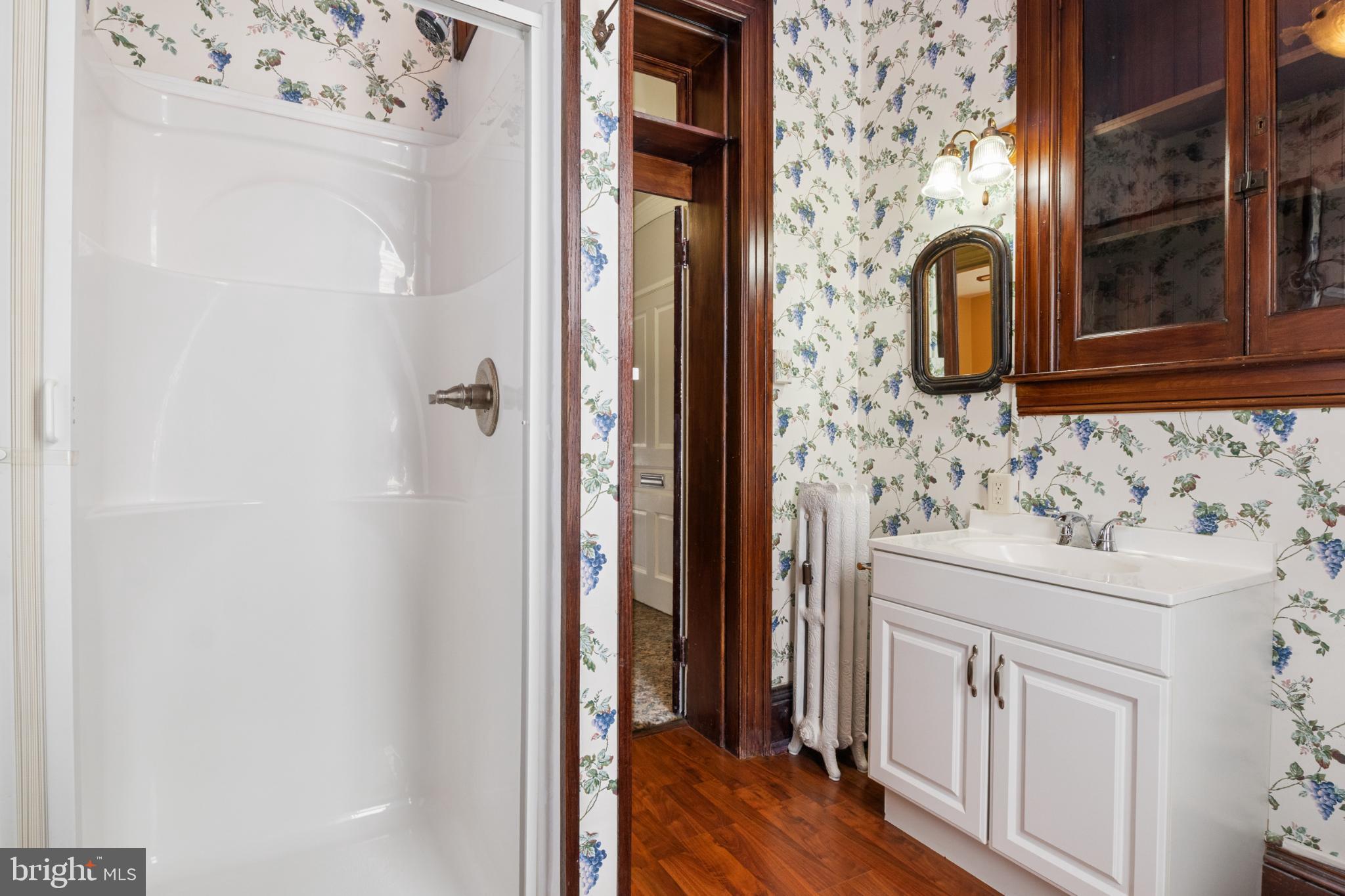 721 South George Street York, PA 17401 - Photo 35 of 78 a bathroom with a sink and a mirror