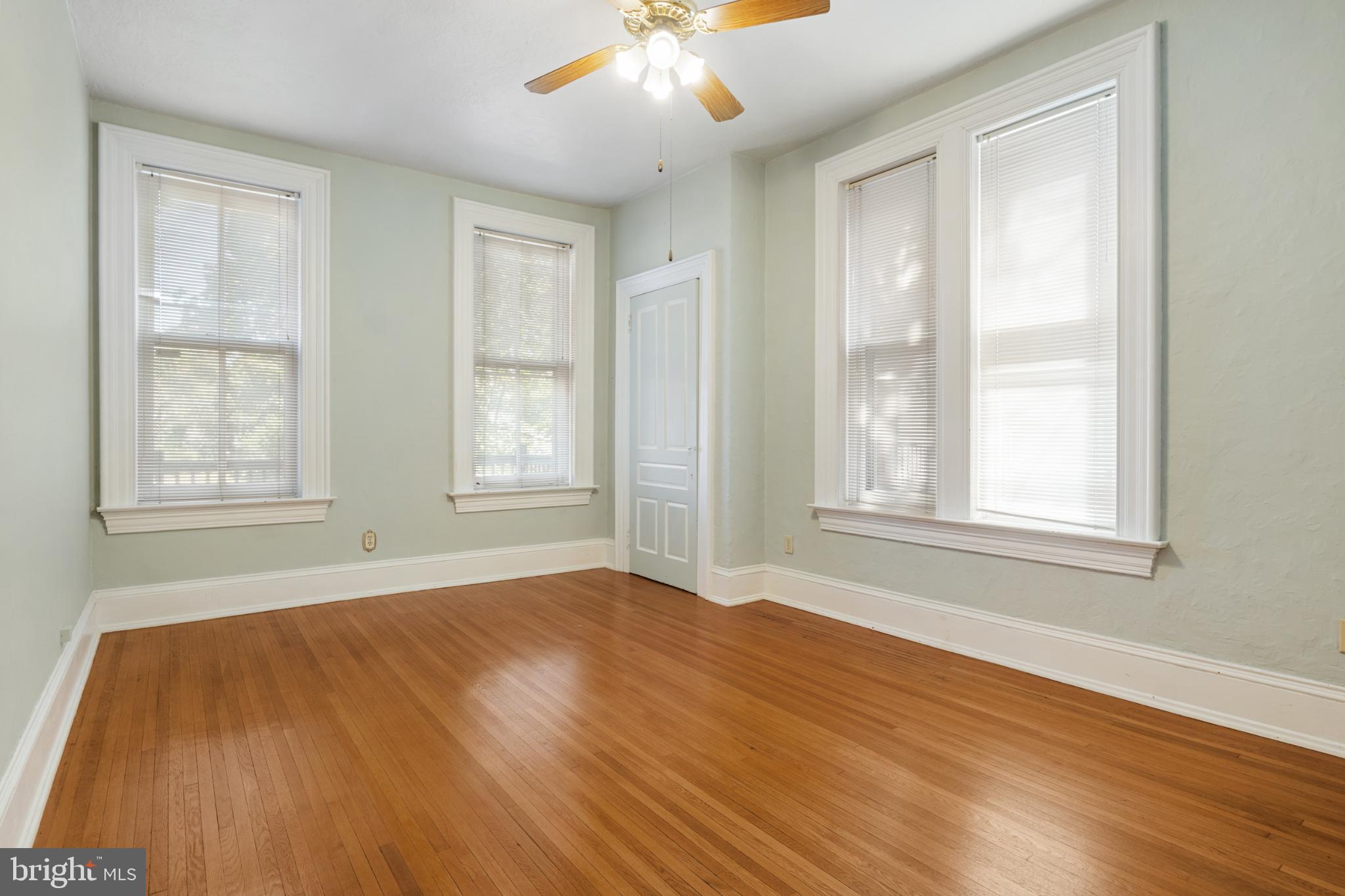 721 South George Street York, PA 17401 - Photo 37 of 78 a view of an empty room with wooden floor and a window