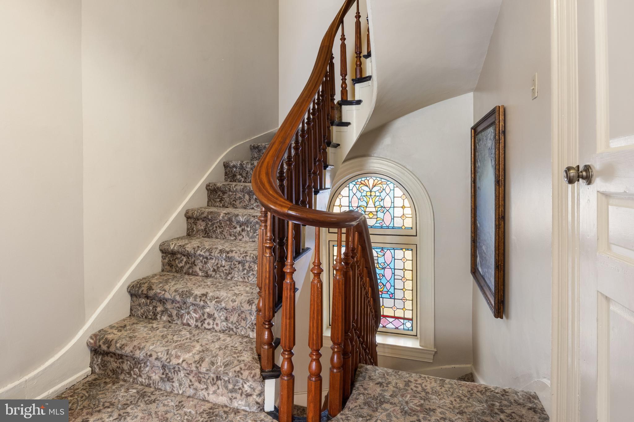 721 South George Street York, PA 17401 - Photo 44 of 78 a view of staircase with wooden floor and a chandelier