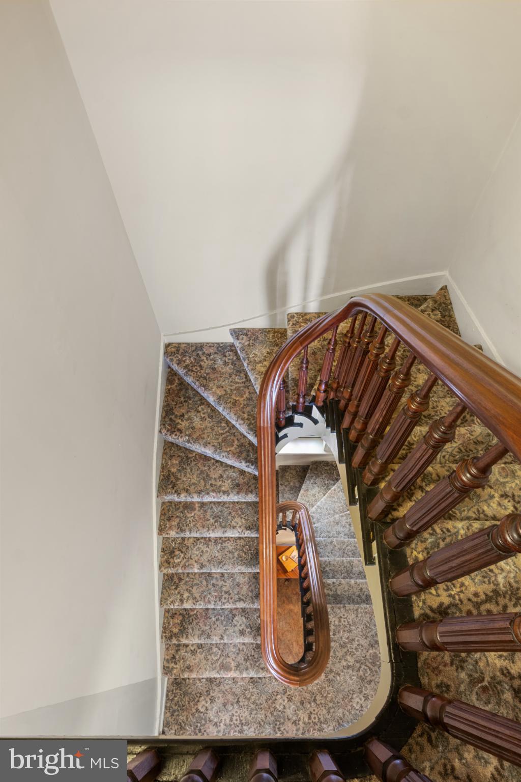 721 South George Street York, PA 17401 - Photo 51 of 78 Elegant staircase with rich wooden railing.