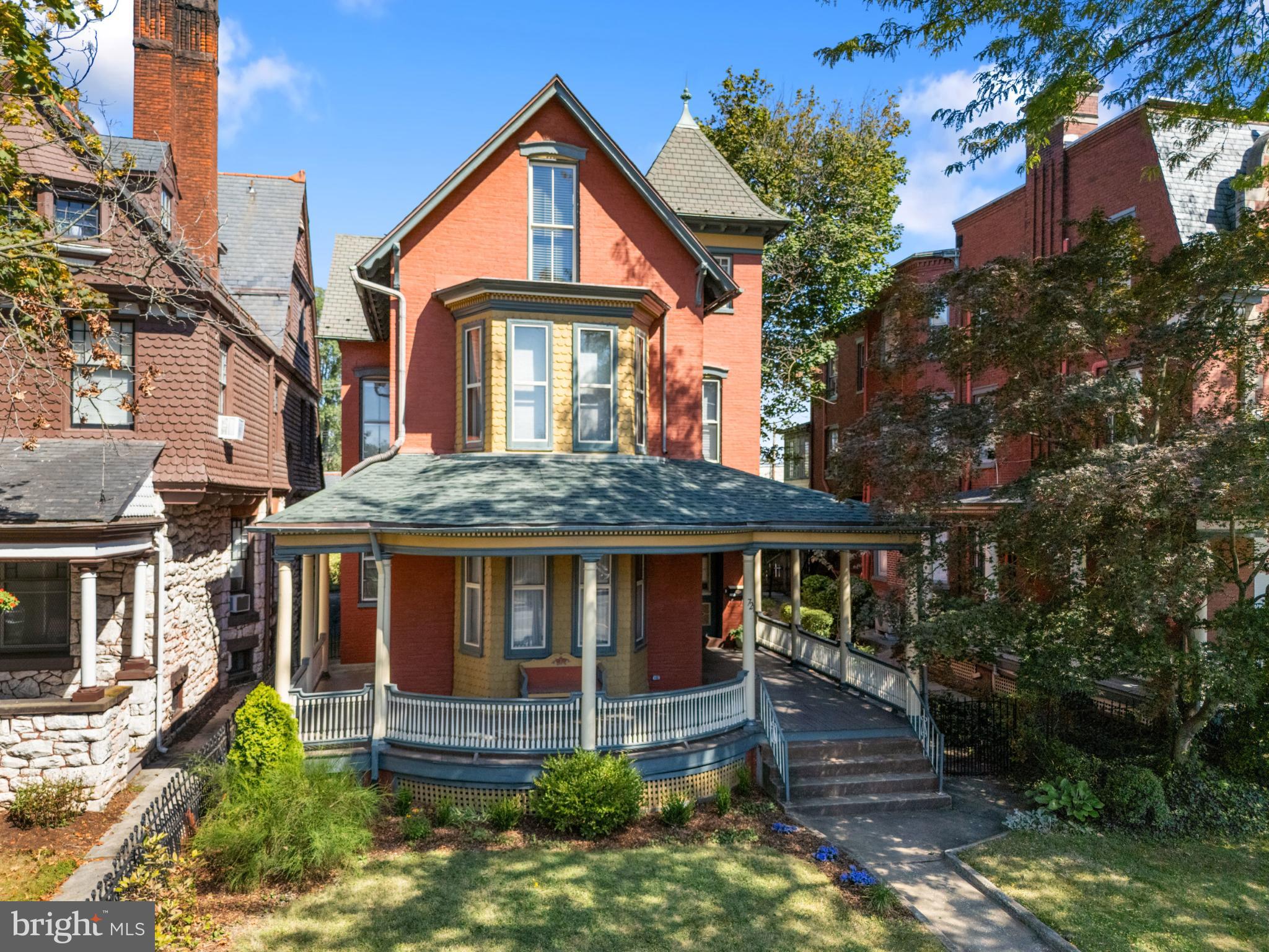 721 South George Street York, PA 17401 - Photo 60 of 78 a front view of a house with a yard and potted plants