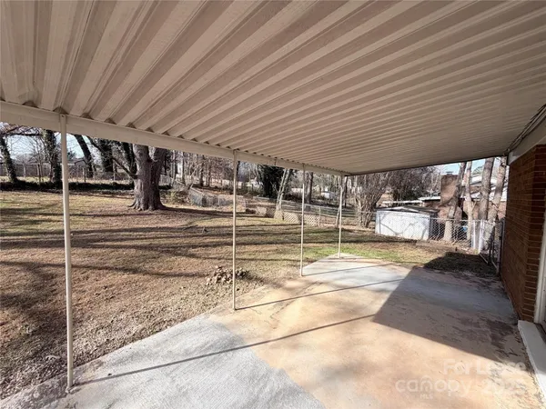 a view of a hall with wooden floor