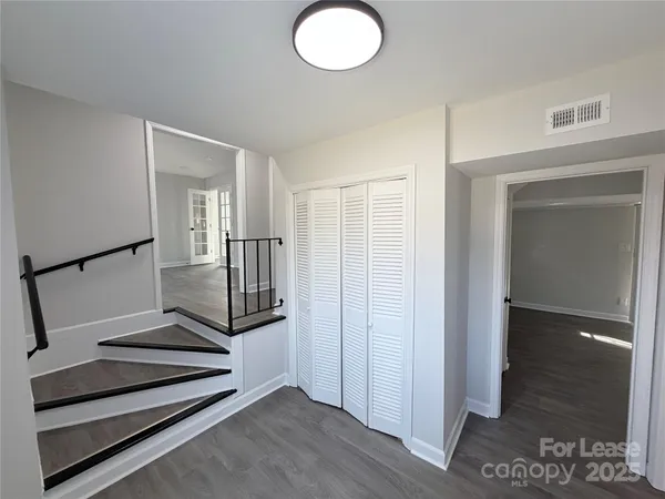 a view of entryway with wooden floor