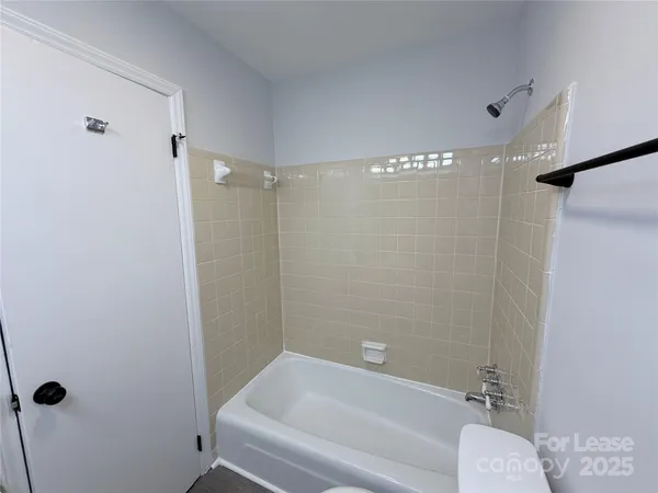 a bathroom with a shower and a toilet