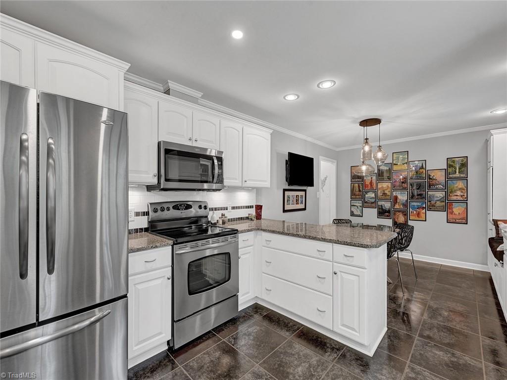 798 Hertford Road Winston-Salem, NC 27104 - Photo 15 of 36 Beyond the L-shaped counter is the breakfast area