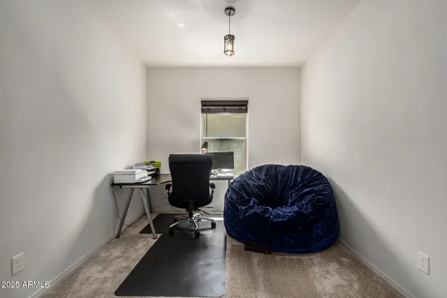 a workspace with furniture and window