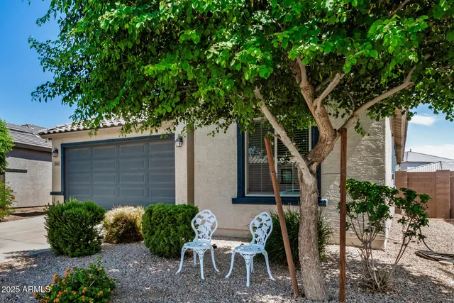 a couple of table and chairs in the patio